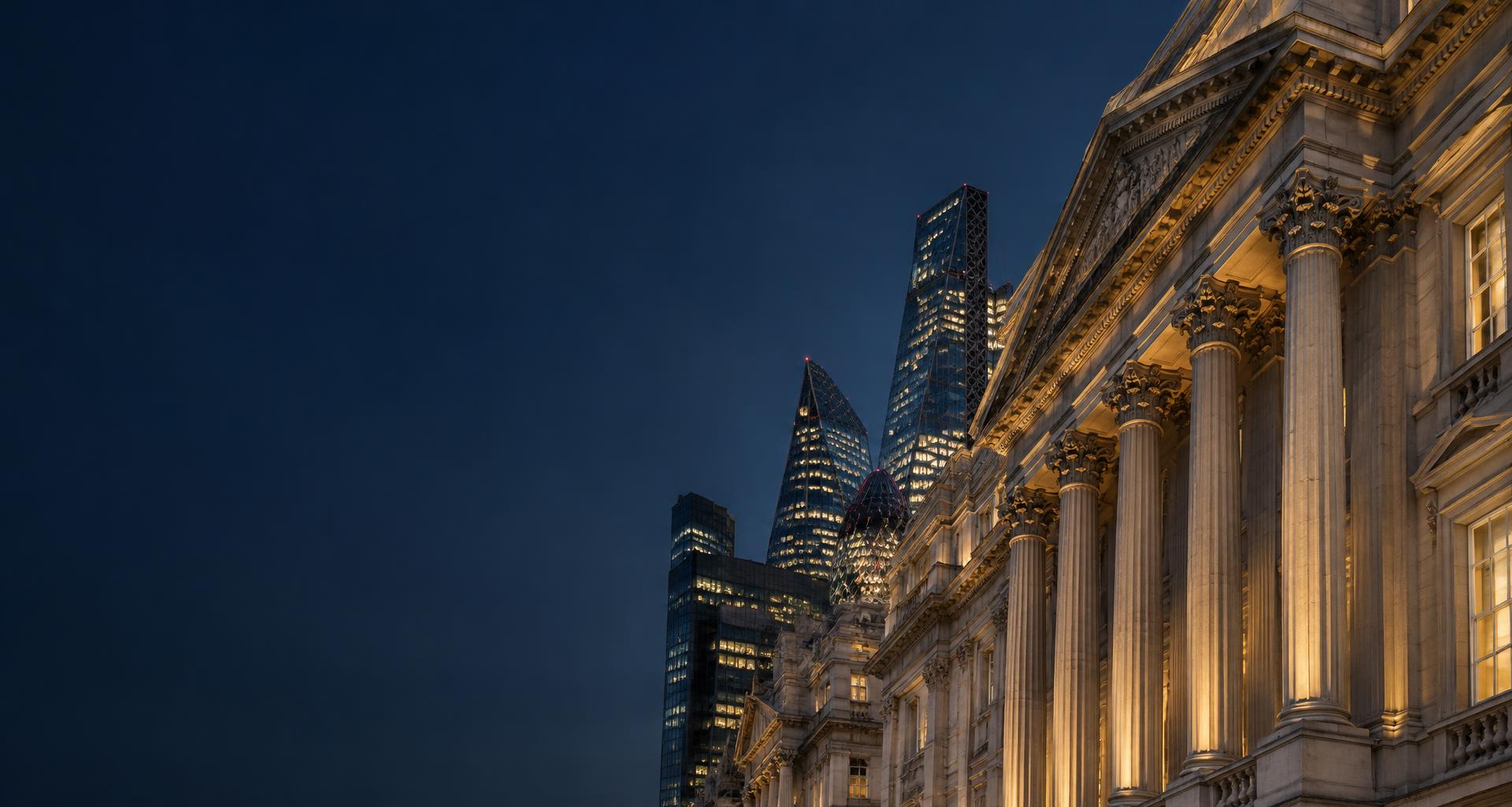 Classical London architecture alongside the City skyline at dusk